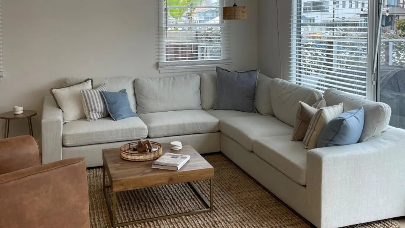 modern apartment living room with L shaped cove sofa
