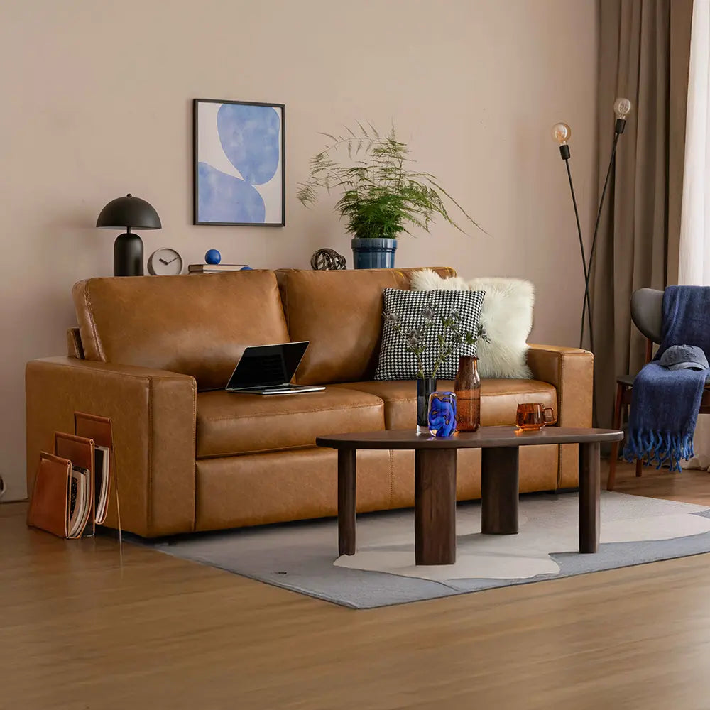 Sleek modern apartment living room with a saddle tan Alba 2-cushion leather sofa.