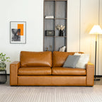 ABCASA Alba Faux Leather Sofa in a living room with a bookshelf and decorative items.