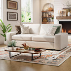 Alba sofa in a living room with a coffee table, rug, and decorative items.