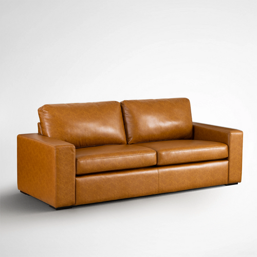 Angled perspective of the Alba saddle tan faux leather sofa with two cushions.
