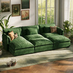 ABCASA forest green sectional sofa in a room with large windows and plants