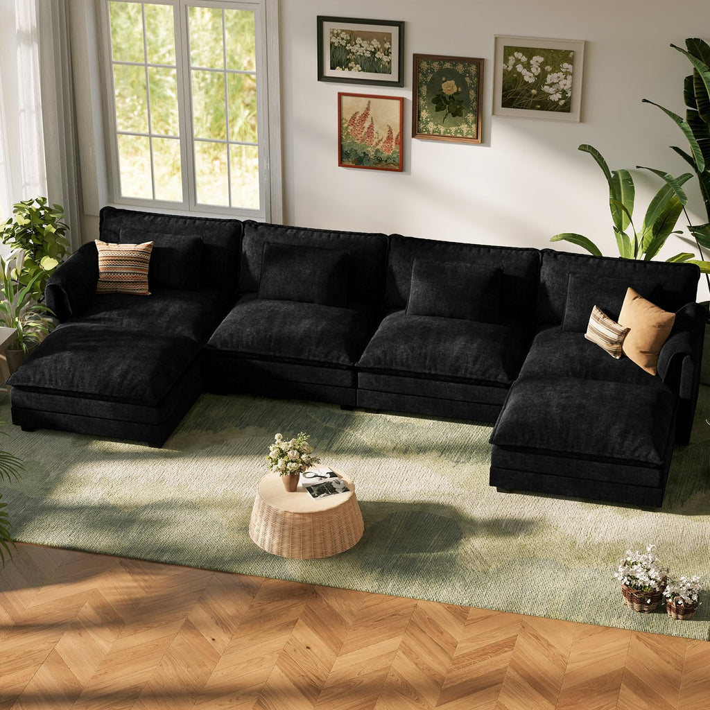 ABCASA Cloud black sectional sofa in a living room with a rug, coffee table, and decorative elements.