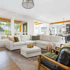 Modern living room with Cove sectional sofa, armchair, and decorative items.