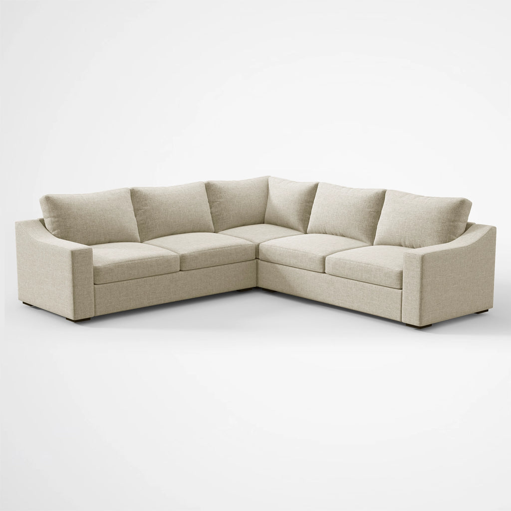 Angled perspective of the ABCASA Cove L-shaped sectional in Pebble Beige fabric.