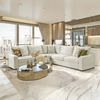 Modern living room with a white Cove sectional sofa, coffee table, and cityscape view.