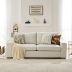 Cove frost white sofa with decorative pillows in a living room setting