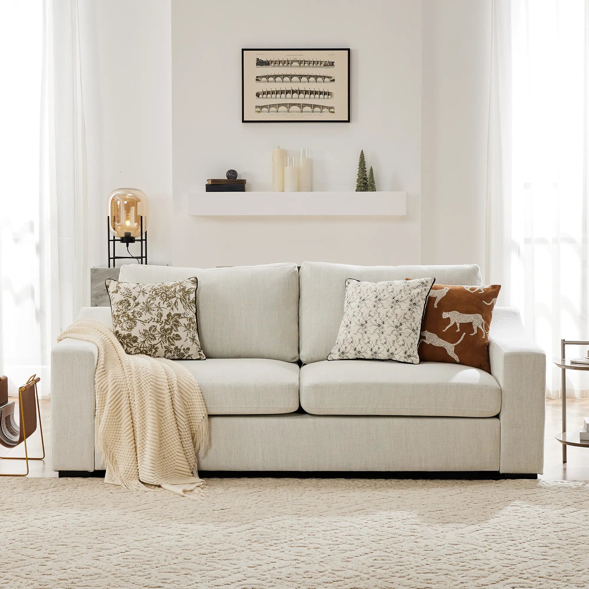 Cove frost white sofa with decorative pillows in a living room setting