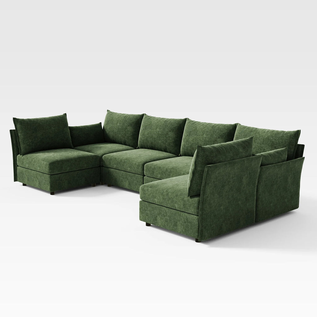 Diagonal wide-angle view of the Huddle 6-piece green modular sofa in a double chaise lounge configuration.