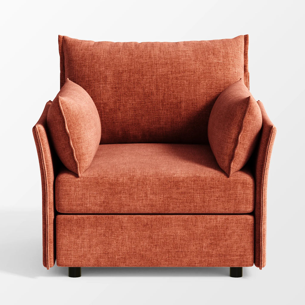 Front view of the ABCASA Huddle chair in terracotta highlighting its soft, oversized cushions.