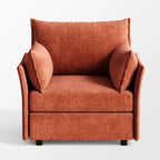 Front view of the ABCASA Huddle chair in terracotta highlighting its soft, oversized cushions.