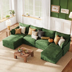 A minimalist modern living room featuring the ABCASA Huddle green modular sofa against a clean, white backdrop with subtle decor.