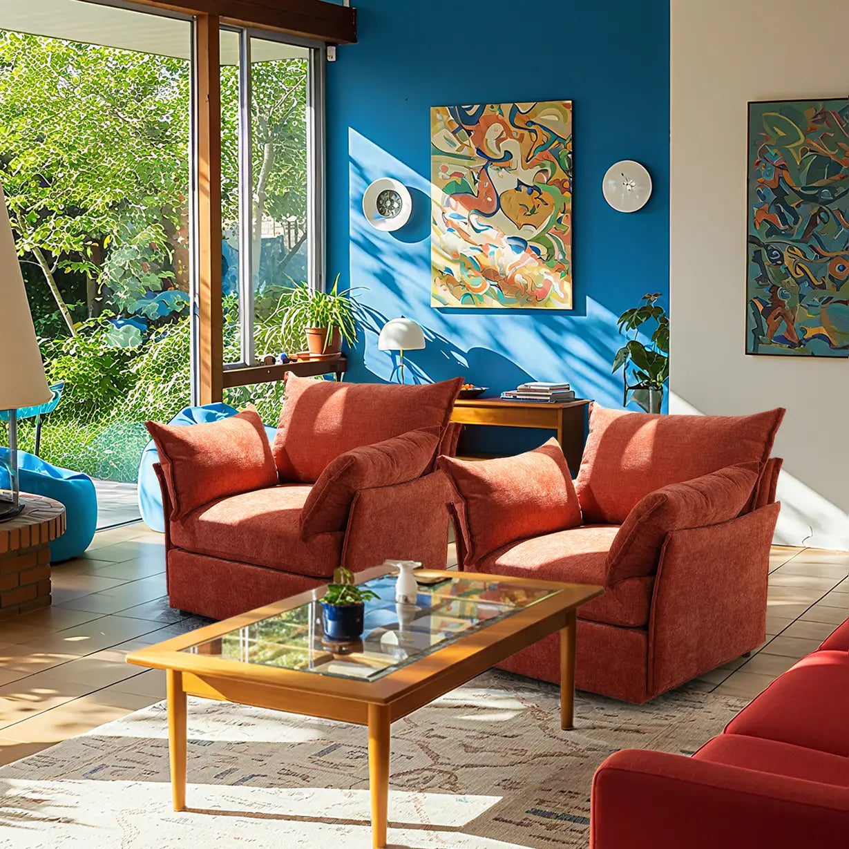 Modern living room with a pair of ABCASA Huddle Accent Chair in terracotta, glass coffee table, and colorful artwork on a blue wall.