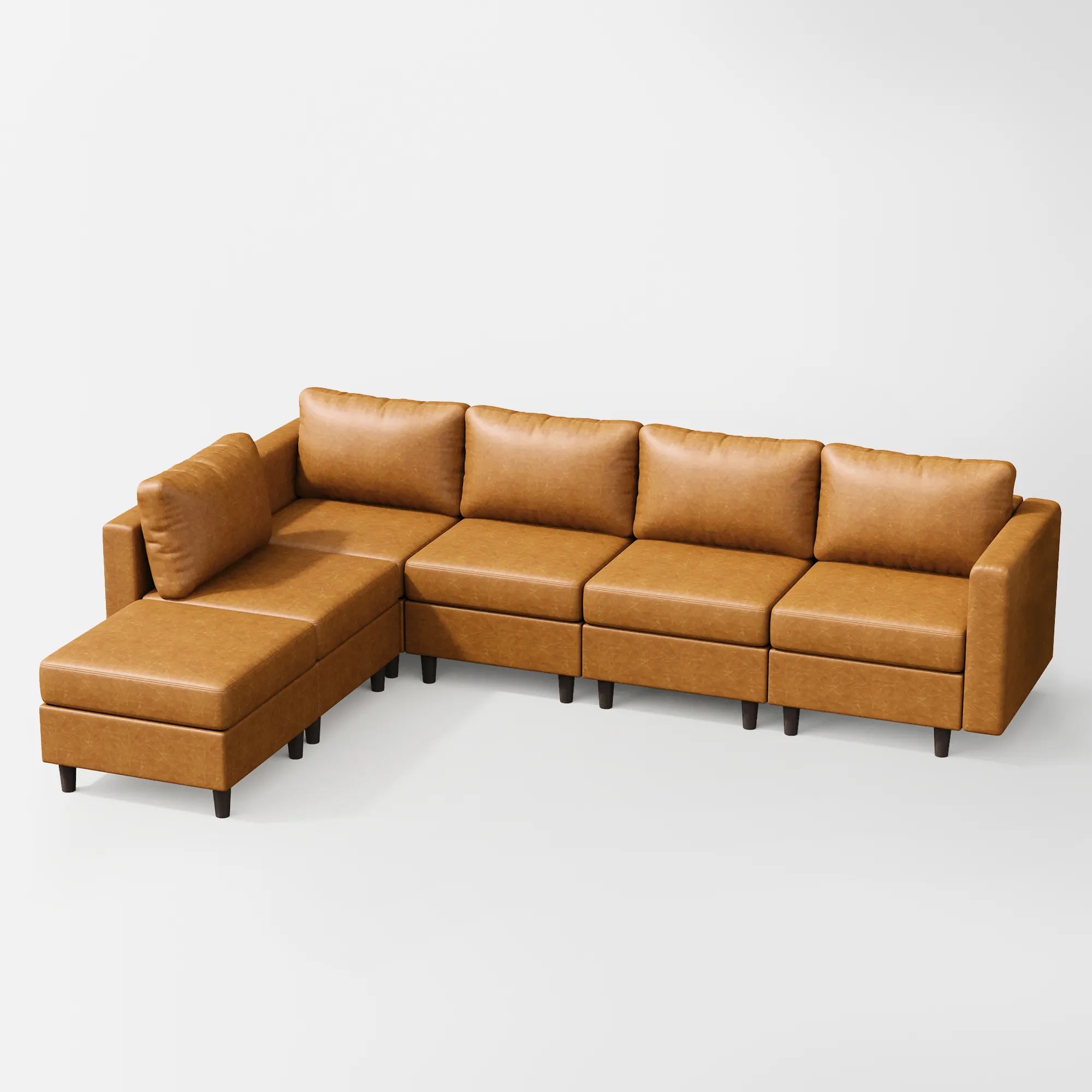 Angled view of the ABCASA Moro 6-piece modular sofa in saddle tan highlighting sectional configuration