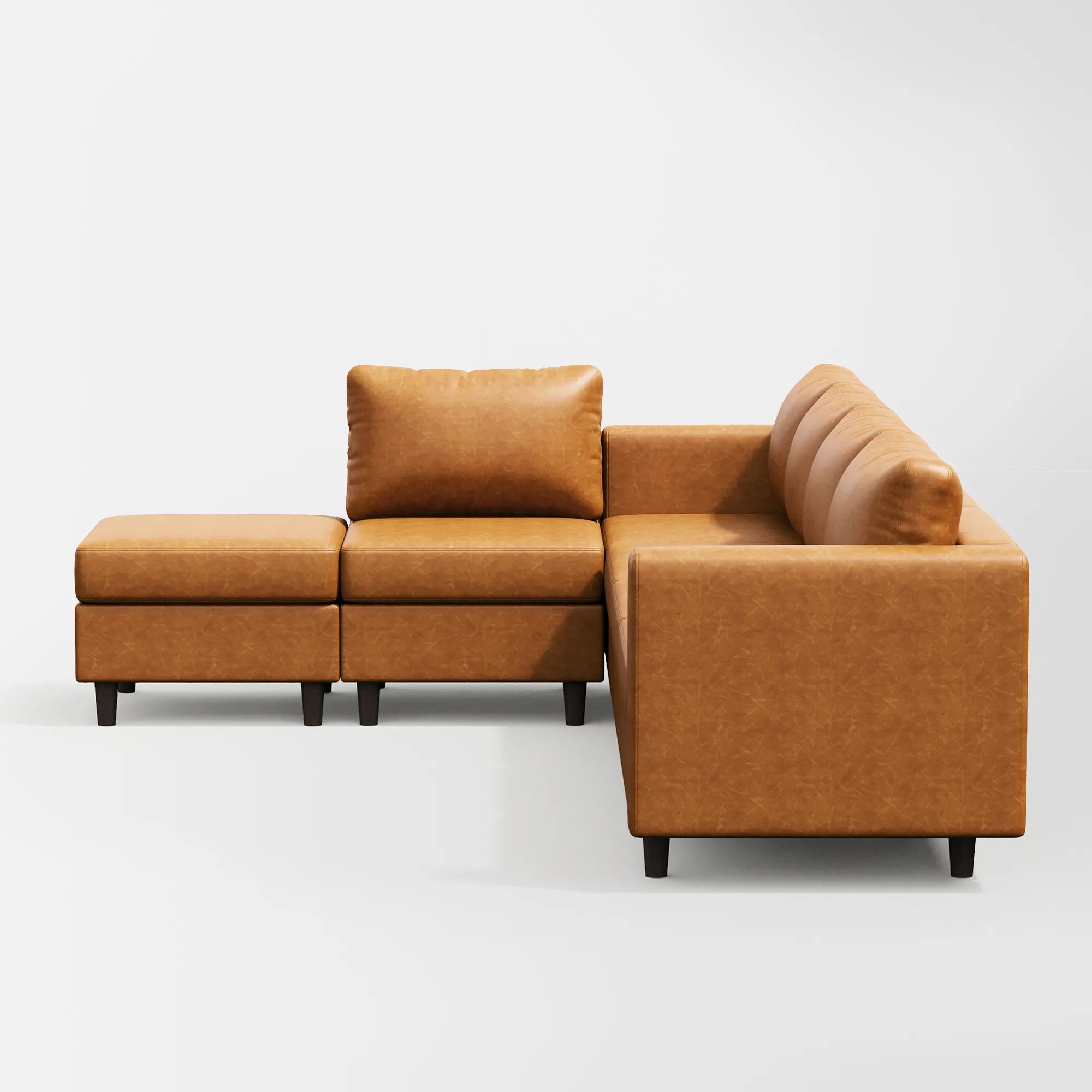 Side view of the ABCASA Moro 6-piece modular sofa in saddle tan showing low-profile arms and deep seats