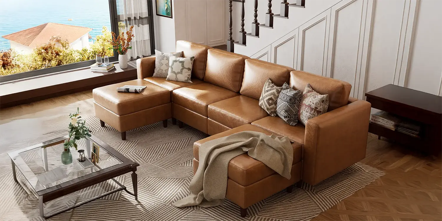 ABCASA Moro Modular Sofa in brown in a living room with a coffee table and decorative items.
