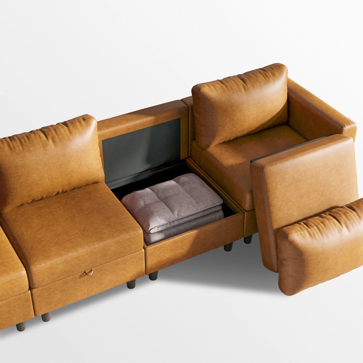 Saddle tan Moro sofa with seat cushion lifted to show hidden storage compartment.