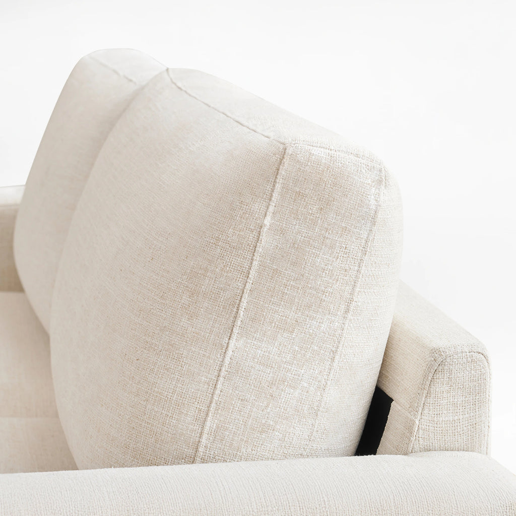 Detail shot of the thick back cushion of the Alba ivory faux linen sofa.