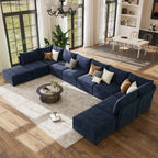 Overlook ABCASA Huddle navy blue sectional sofa in a living room with a coffee table and decorative pillows.